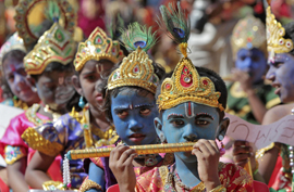 School children dressed as Hindu Lord Krishna take part in a function held ahead of "Janamashtmi" celebrations in the southern Indian city of Chennai