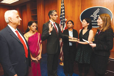 Dr. Vivek Murthy taking Oath by Putting his hand on Bhagavad Gita 