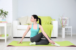 Young woman doing yoga at home