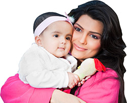 portrait of Indian mother with little baby girl in outdoors