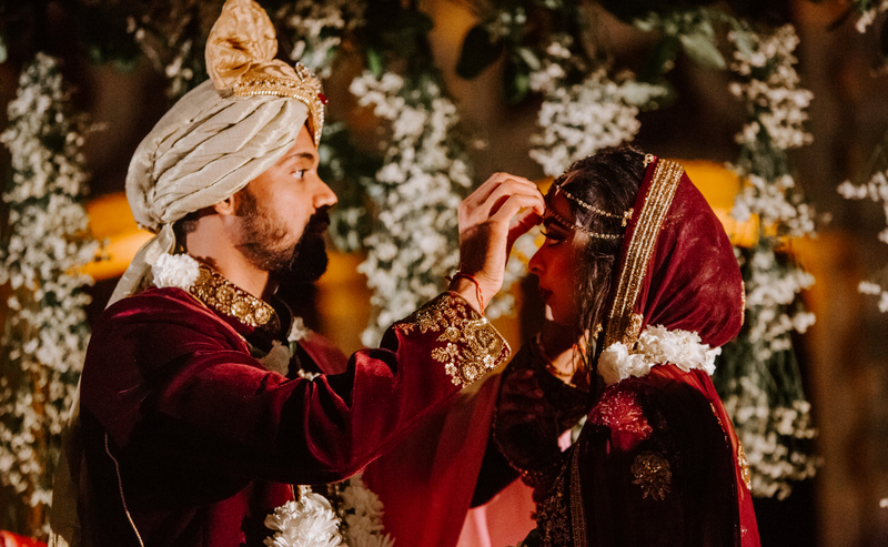 Indian Groom Putting Sindoor On Birde's Maang