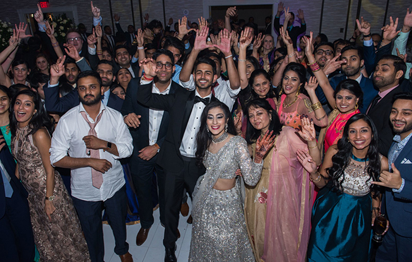 Indian Wedding Reception Guest with Indian Bride and Groom