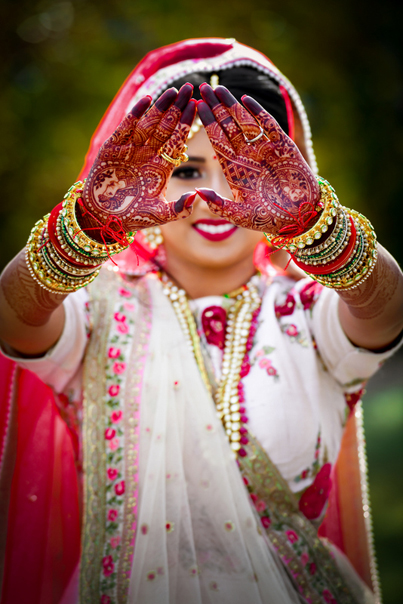 Indian Bride Showing her Mehndi Design