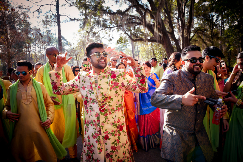 Handsome Indian Groom Dancing with Friends and Family