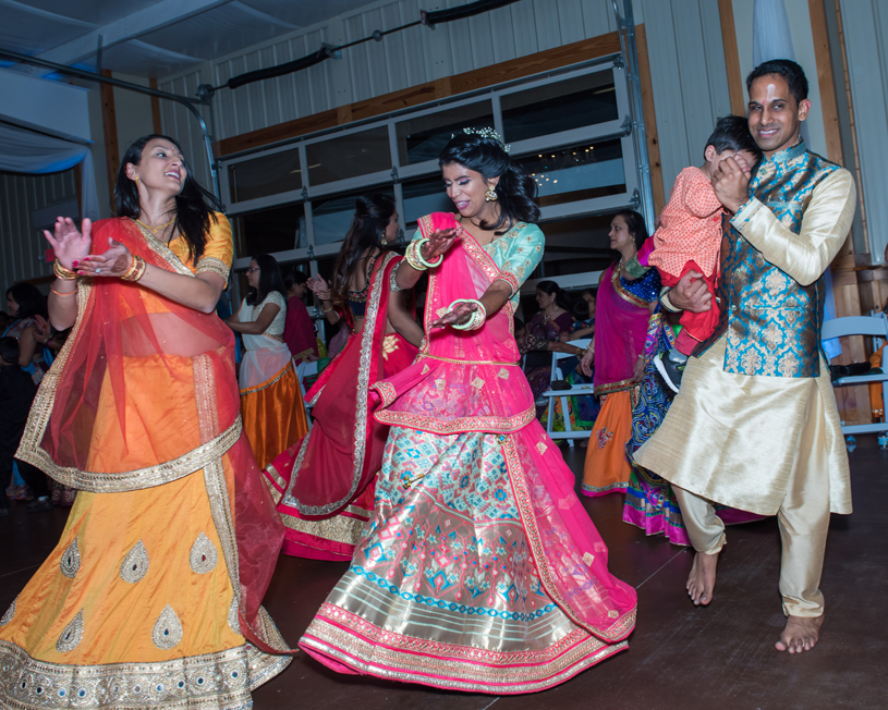Indian Bride and Groom Dancing at their Sangeet Ceremony