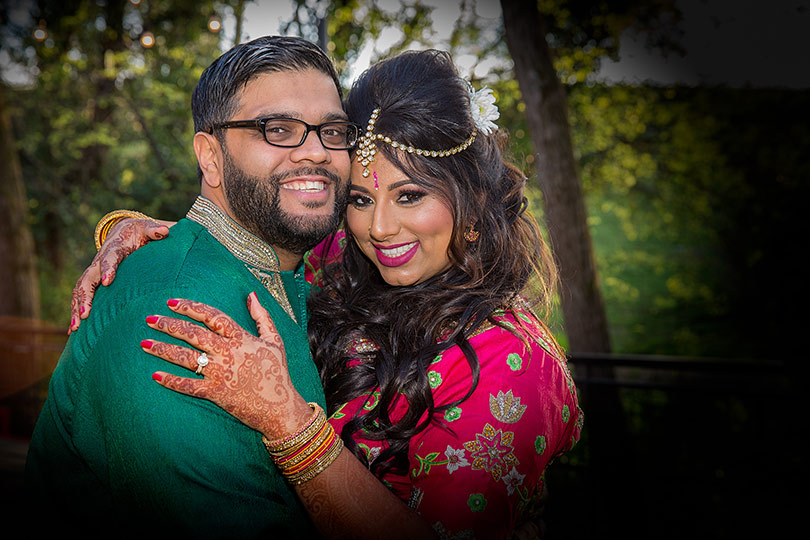 Striking Shot of Indian Bride and Groom at their Sangeet Outfil