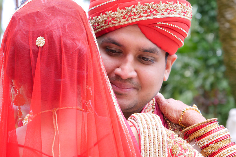 Adorable hug by Indian groom