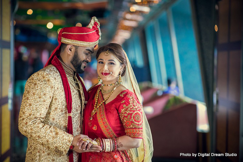 Indian newlyweds posing for elegant pictures