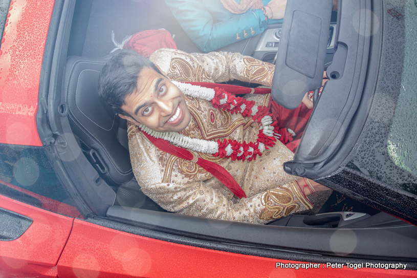 Groom waiting for the bride in car