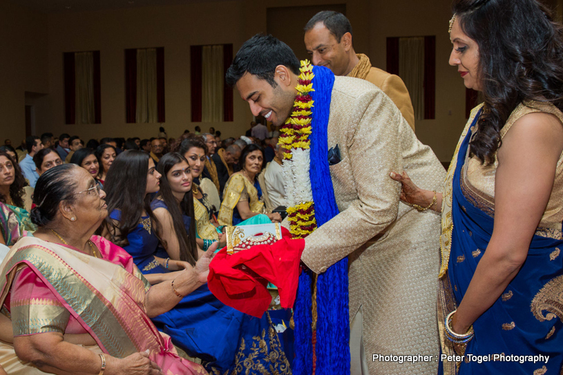 Groom taking blessings from Grand Mother