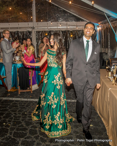 Indian Couple entering at the wedding reception