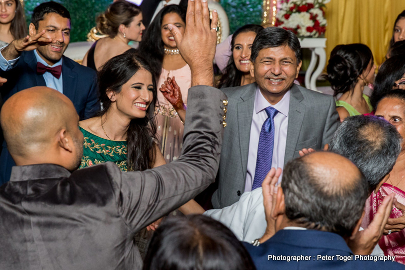 Family Members welcoming indian Bride