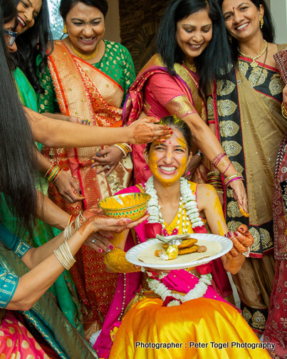 Friends Applying Haldi to Bride