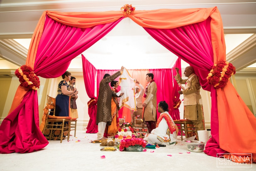 white clothe putting between Bride and Groom 