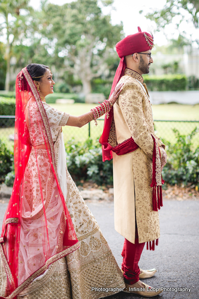 Bride and groom posing outdoors