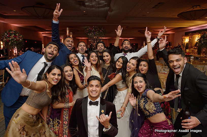 Indian Bride and groom having fun with friends and family