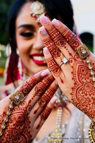 Bride posing her henna hand