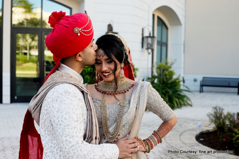 Groom Kissing On forehead of indian Bride