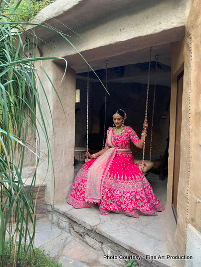 Gorgeous Bride Sitting on the swing for a photoshoot