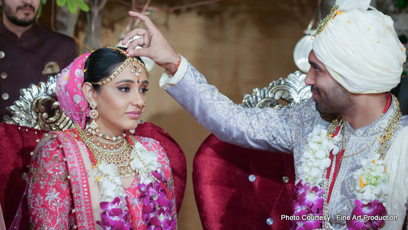 Applying Sindoor to Bride's Forehead