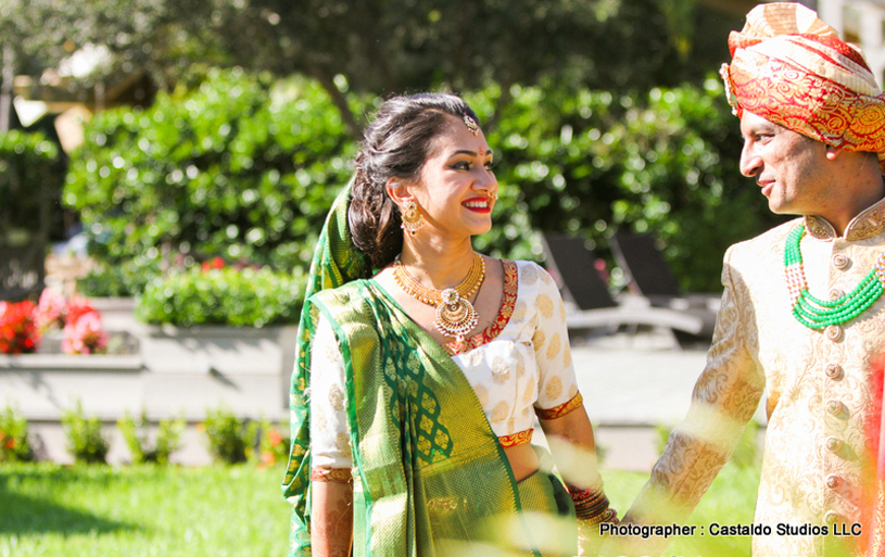 Indian Bride and Groom Walking with holding Each Other's Hand