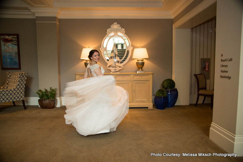 Bride standing wearing white sleeveless gown