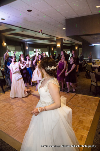 Bridesmaids going to catch Indian Brides bouquet