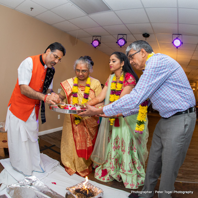 Indian Bride and groom smiling during photoshoot