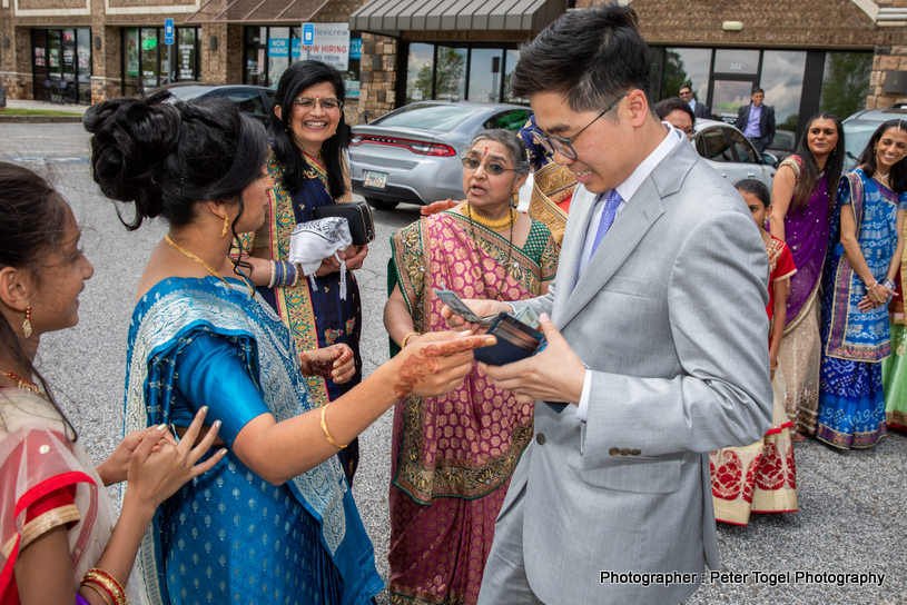 Indian Couple Posing with bridesmaids and groomsmen