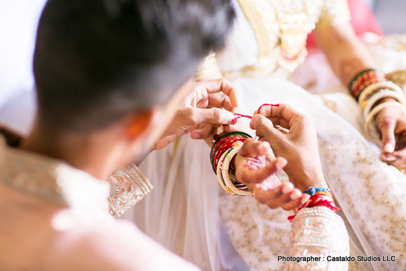 Last touchups of indian bride makeup