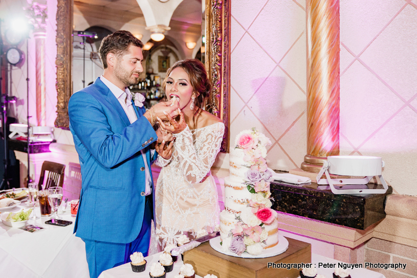 Indian Groom feeding cake to Indian Bride