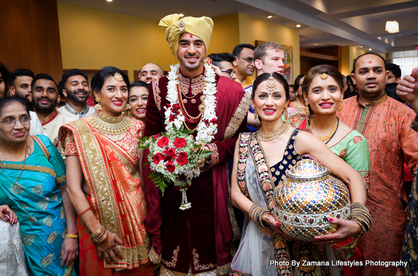 Groom posing with the family members