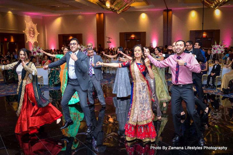 Friends and Family Dancing at the wedding Sangeet