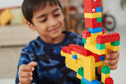 Young boy playing Lego