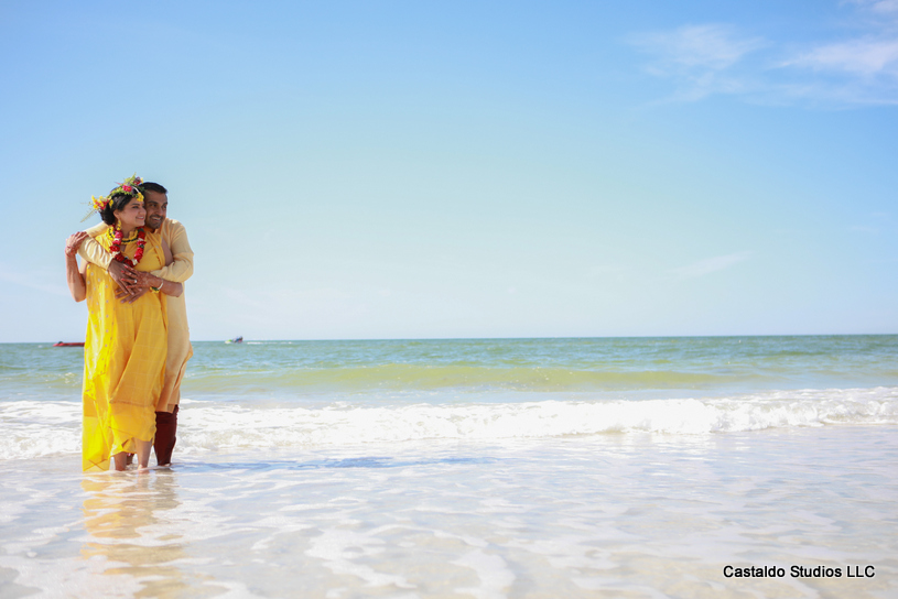 Gorgeous Pose by indian Couple in Haldi Outfit