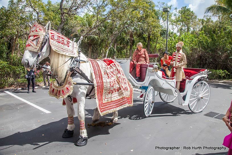 Indian groom entering on horse carriage