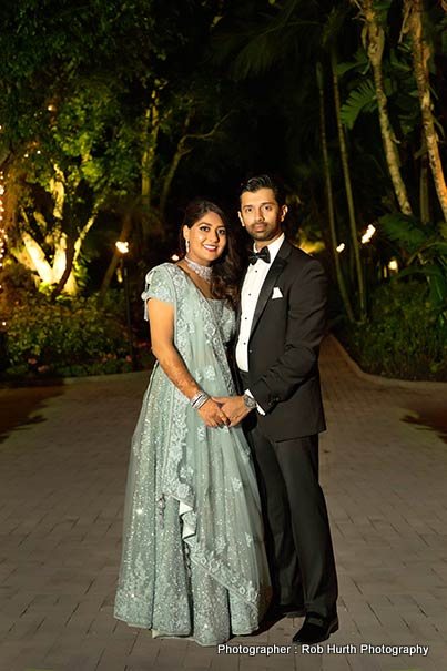 Indian Groom and bride posing outdoors