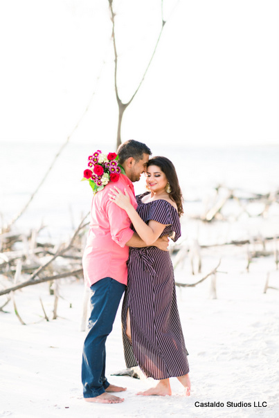 Groom Giving Flowers to Bride