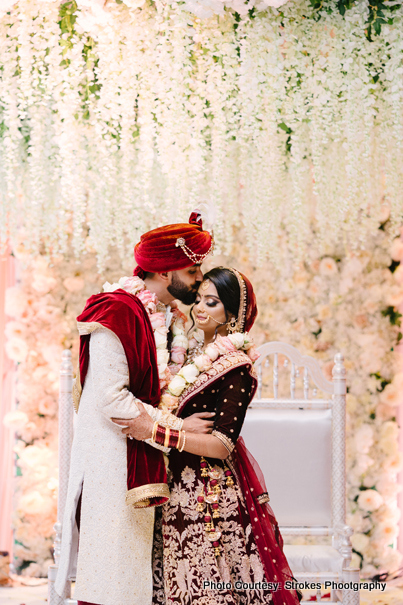 Indian groom Kissing on the forehead