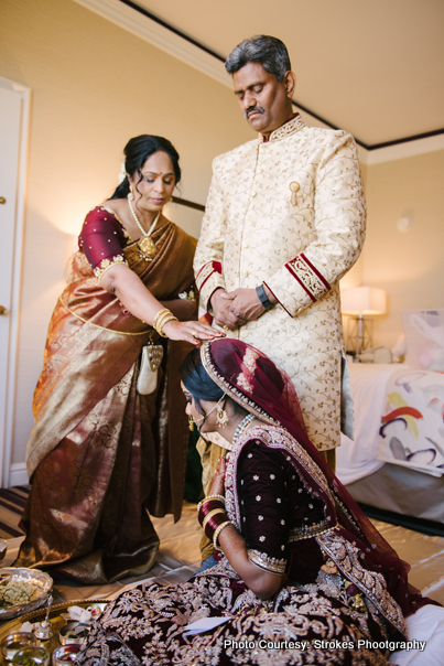 Bride bending down to her parents