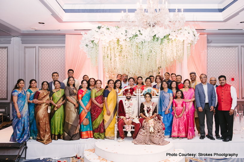 Couple posing with guests