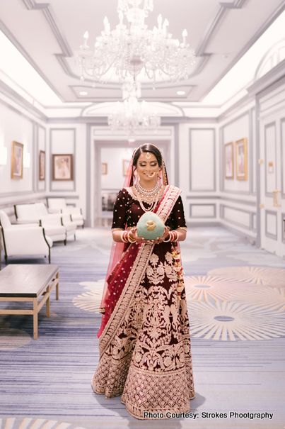 Gorgeous Indian Bride Holding Coconut for Indian Wedding Rituals