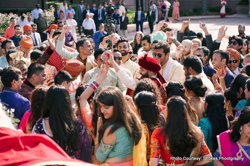 Indian groom entering wedding hall