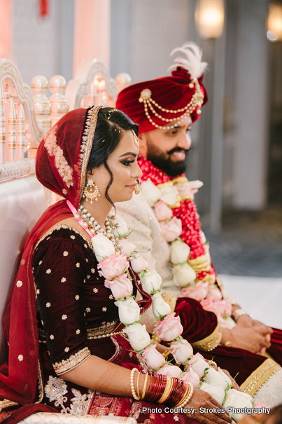 Indian Couple posing in Wedding Chauri