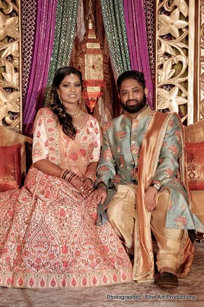 Bride and groom posing for a photo