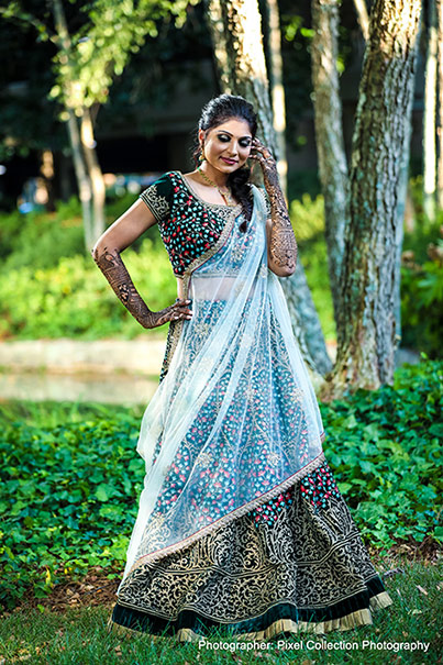 Glamorous indian bride posing outdoors