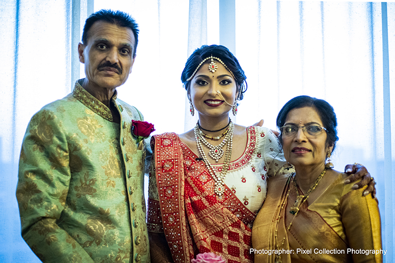 Indian Bride with Family posing for a photo