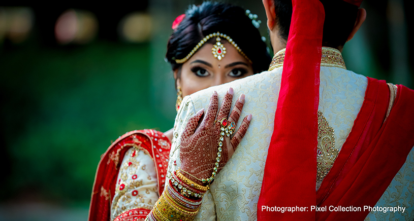 Adorable indian bride hugging to the groom