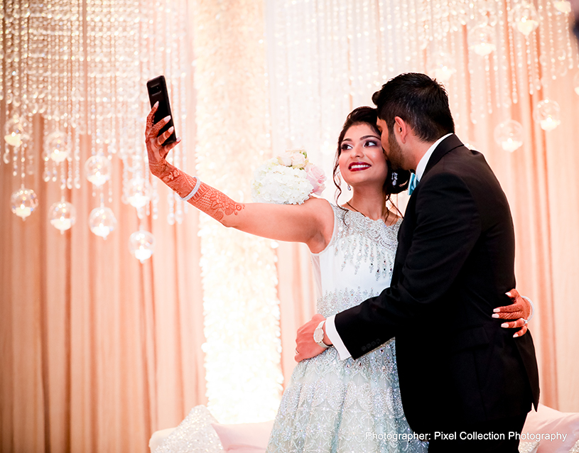 Indian newlyweds taking a selfie