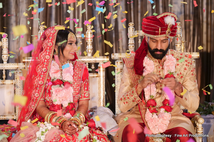 Newly-weds posing for a photo